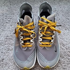 Women's Nike mesh tennis shoes size 9.5 in Grey/Gold/White